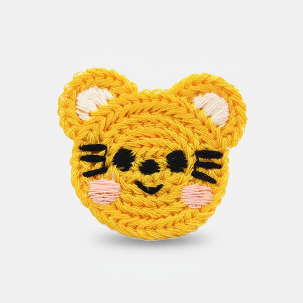 Häkelapplikation/Aufnäher ca. 36 mm x 35 mm - schmunzelnder Tiger - gelb