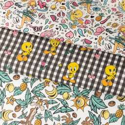 Webware Baumwolle Popeline Digitaldruck Tweety - Kojote und Taz im Blätterwald - weiß