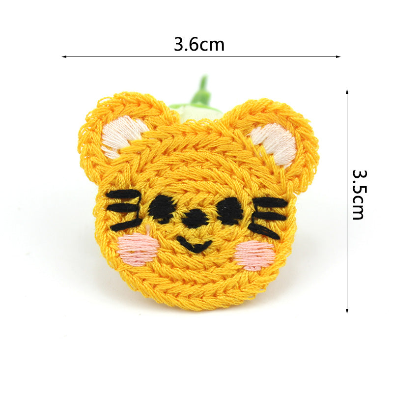 Häkelapplikation/Aufnäher ca. 36 mm x 35 mm - schmunzelnder Tiger - gelb