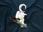 Nahaufnahme von Sweat French Terry PANEL ca 140 cm  x 70 cm - Astronaut mit Skateboard - dunkelblau 
