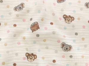 Nahaufnahme von Musselin Baumwolle Double Gauze - süße Tiere und Punkte - helles beige