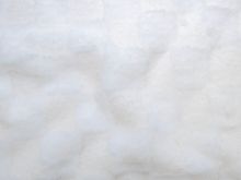 Nahaufnahme von Fellimitat Bouclé - Karomuster - altrosa
