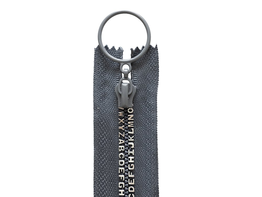 Reißverschluss "Buchstaben" nicht trennbar ca. 15cm - grau